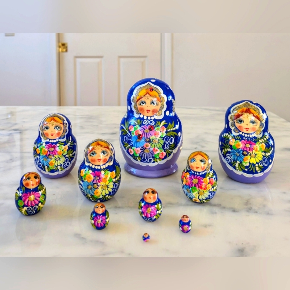 NWT. Beautiful set of Blue Russian Matryoshka Dolls with Colorful Floral Design.